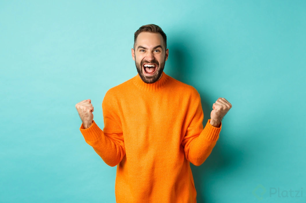 excited-man-celebrating-victory-rejoicing-making-fist-pump-gesture-winning-looking-satisfied-saying-yes-achieve-goal-standing-light-turquoise-wall_1258-23890.jpg