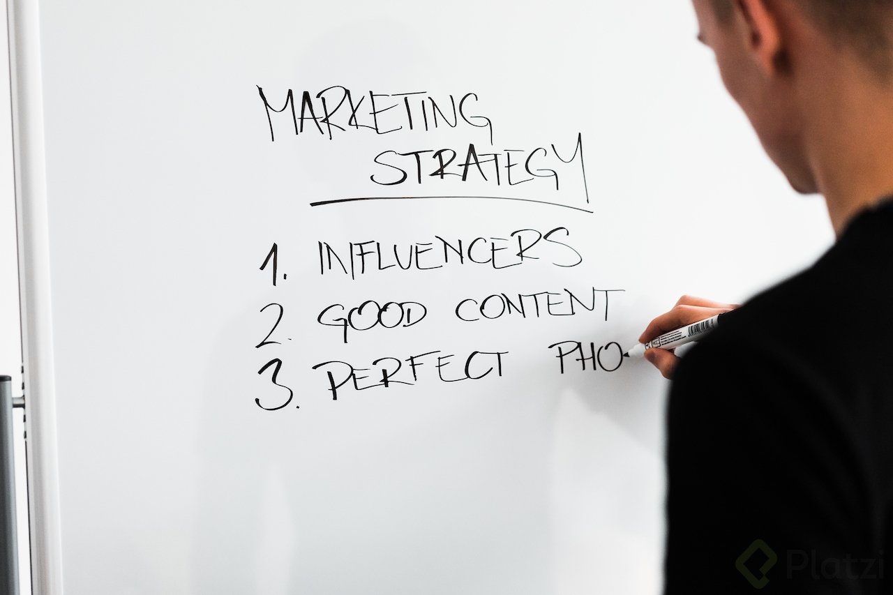 marketing-expert-writing-new-marketing-strategy-on-whiteboard-picjumbo-com.jpg